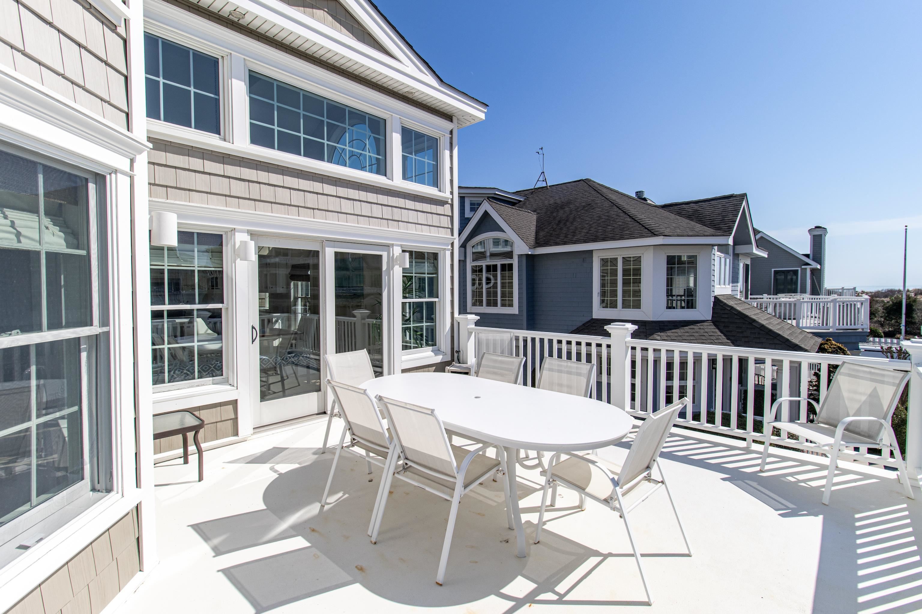 153 76th Street Avalon, NJ 08202 - Photo 25 of 33 a front view of a house with a patio