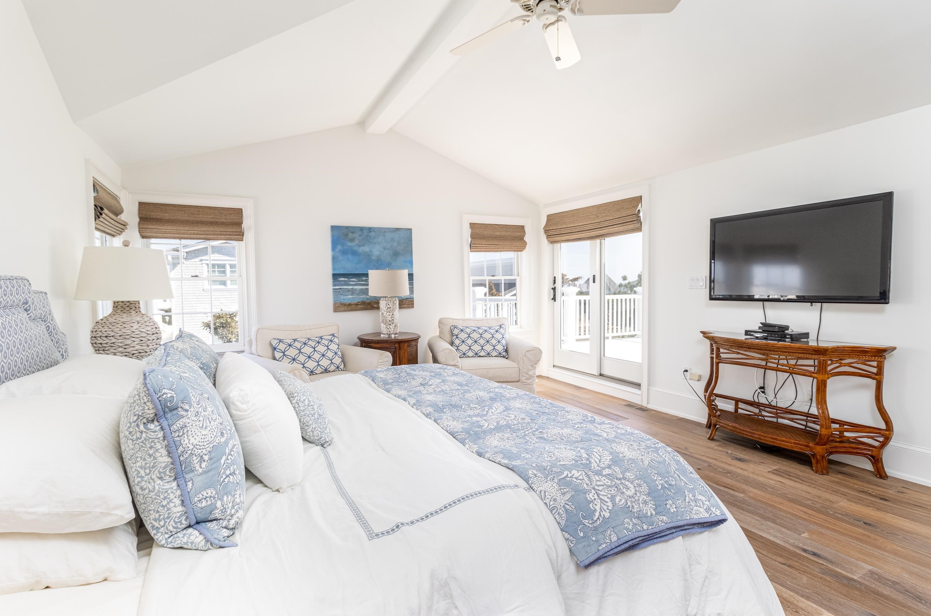 153 76th Street Avalon, NJ 08202 - Photo 29 of 33 a spacious bedroom with a bed and a flat screen tv