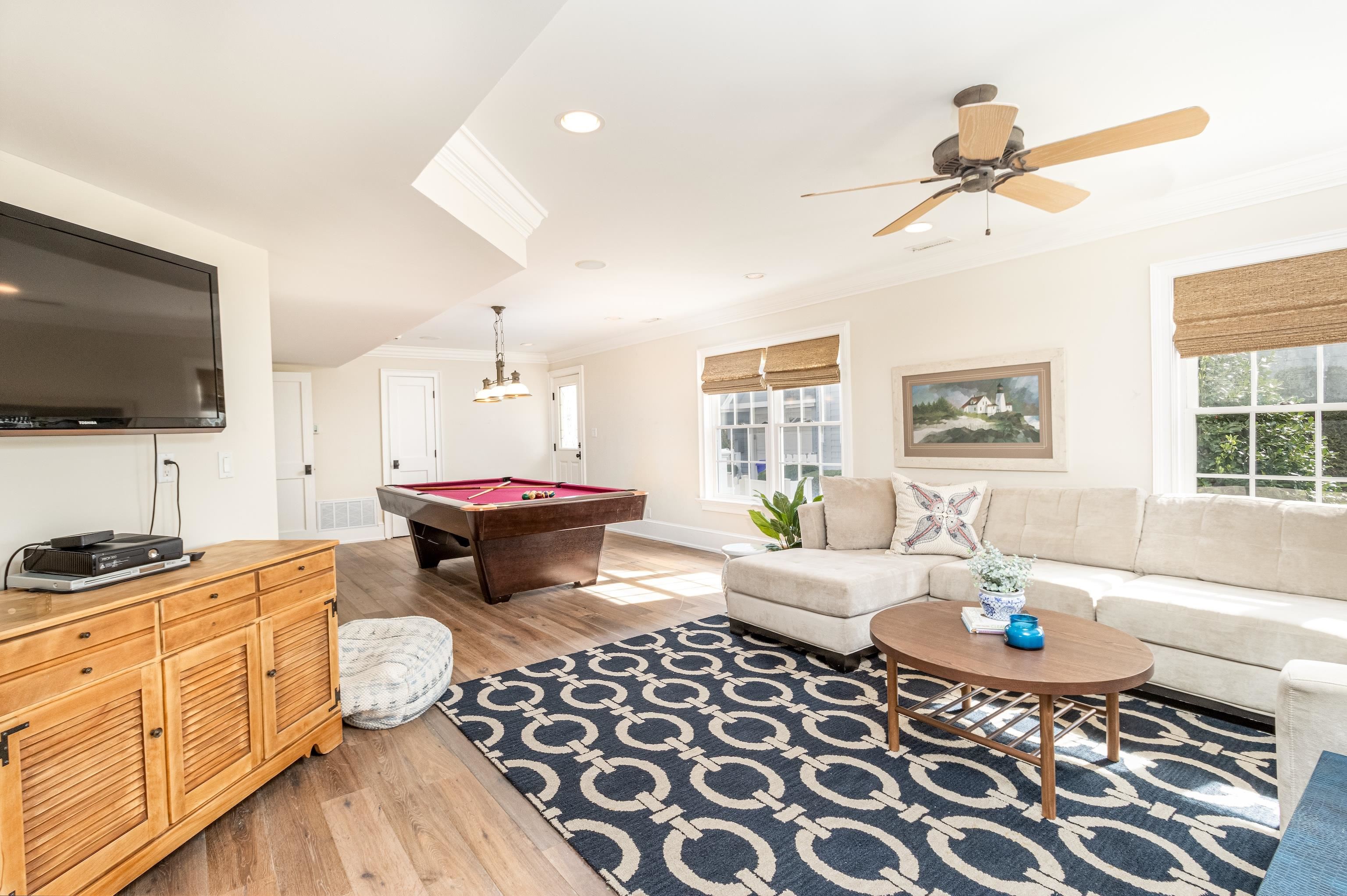 153 76th Street Avalon, NJ 08202 - Photo 6 of 33 a living room with a couch and a flat screen tv