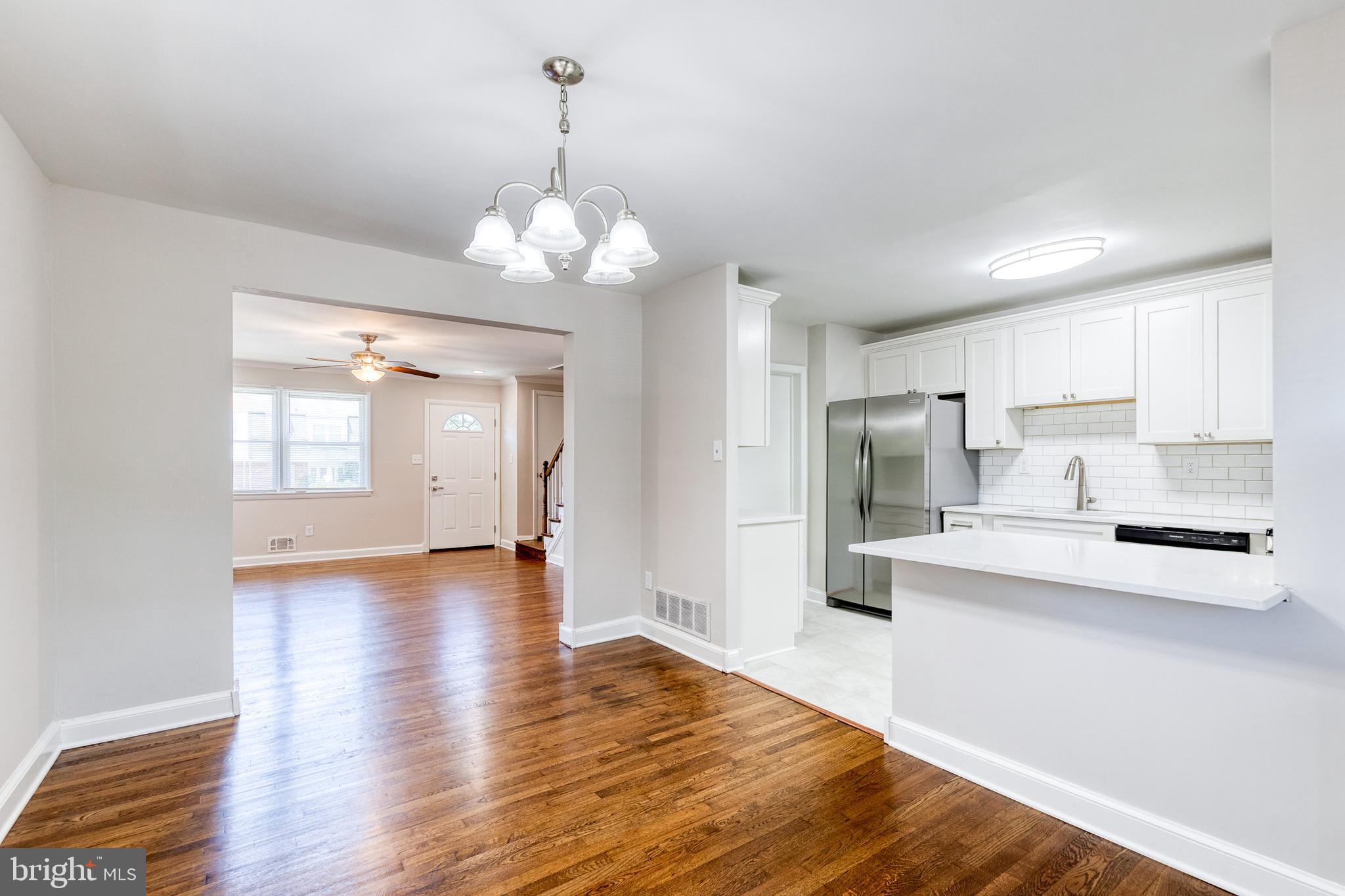 5649 Utrecht Road Baltimore, MD 21206 - Photo 20 of 42 a view of a kitchen with granite countertop stainless steel appliances and wooden floor