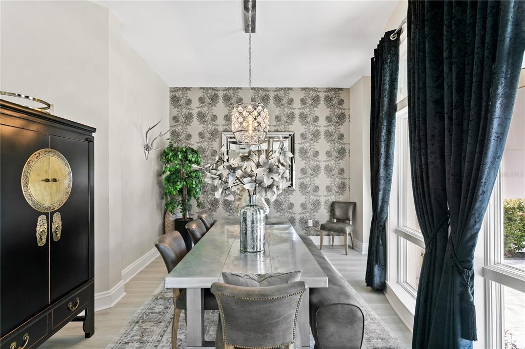 420 Coffee Pot Riviera Northeast St. Petersburg, FL 33704 - Photo 12 of 55 a view of a dining room with furniture window and wooden floor