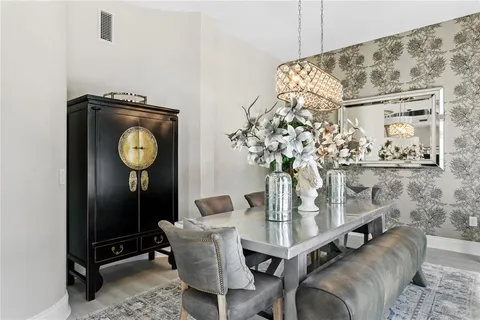 a bathroom with a sink mirror and toilet