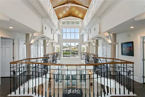 a dining table chairs and a chandelier