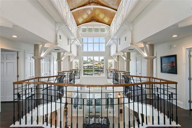 a dining table chairs and a chandelier