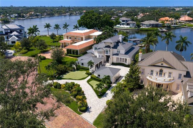 an aerial view of a house with a lake view