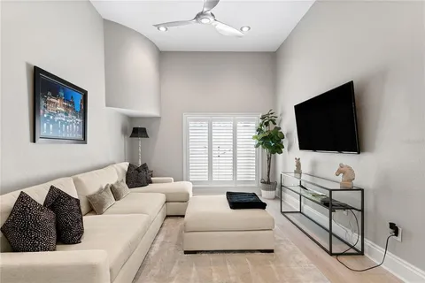 a bathroom with a granite countertop toilet a sink and a mirror