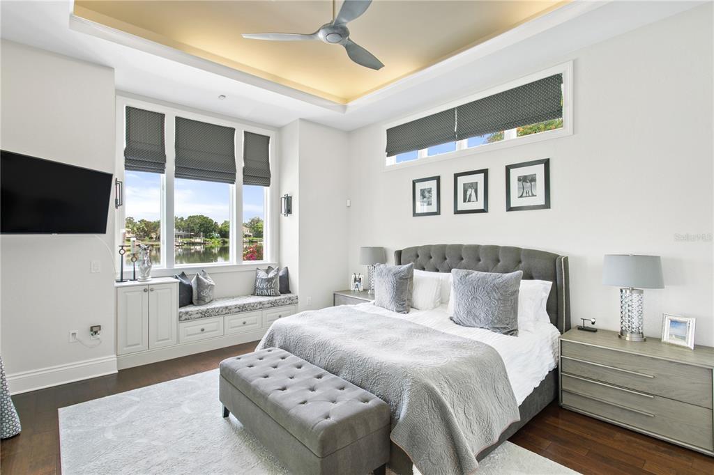 420 Coffee Pot Riviera Northeast St. Petersburg, FL 33704 - Photo 28 of 55 a bedroom with a bed and a flat screen tv