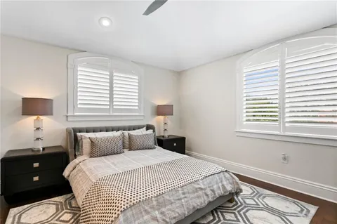 a view of a bedroom with a hardwood and hallway