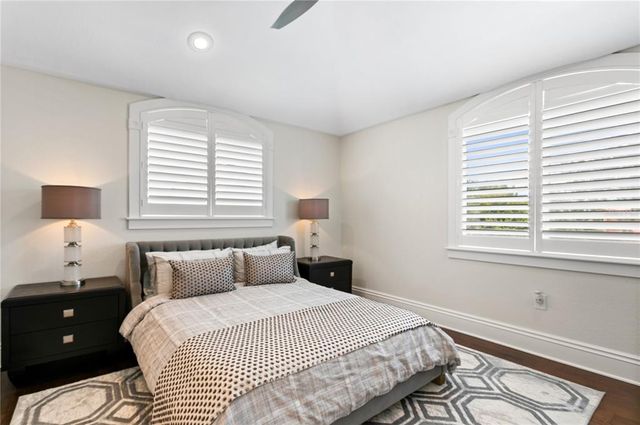 a view of a bedroom with a hardwood and hallway