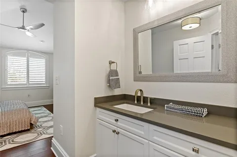 a bedroom with a large bed and a window