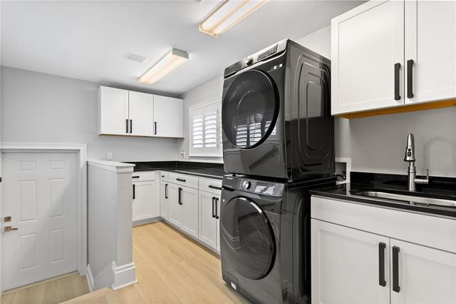 an aerial view of a house with a lake view