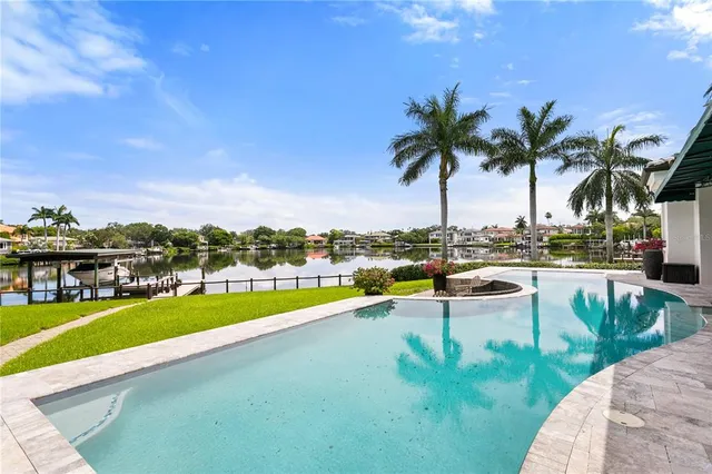 a view of a swimming pool and lounge chair