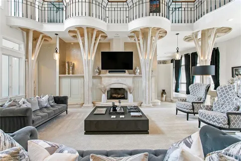 a living room with fireplace furniture and a flat screen tv