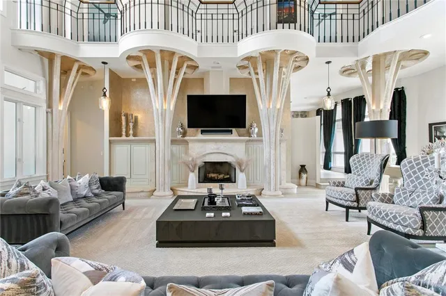 a living room with fireplace furniture and a flat screen tv