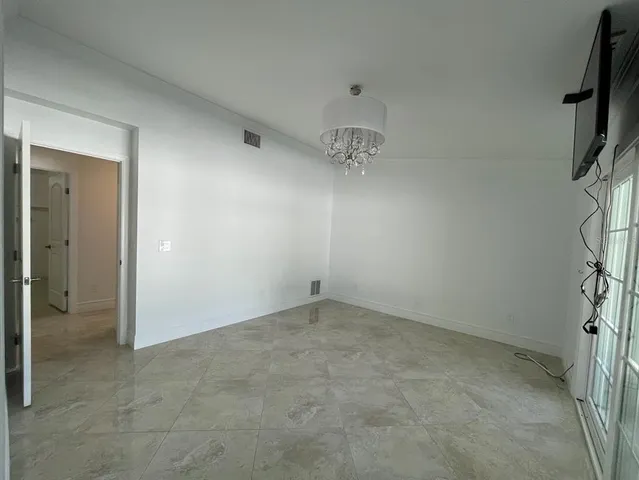 a bathroom with a shower and a sink