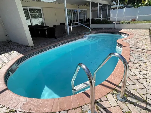 an outdoor sitting area with furniture
