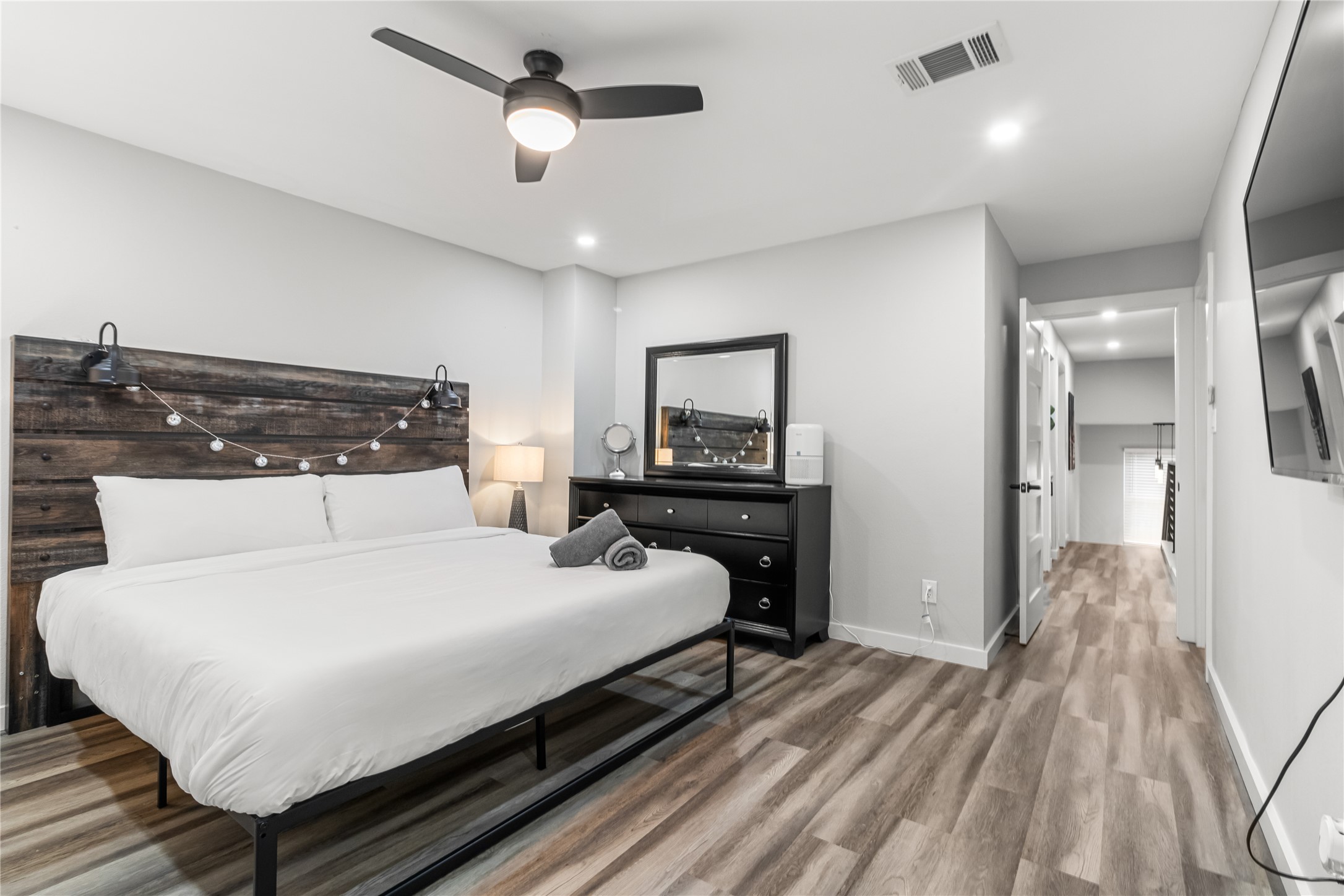 5405 Meadow Crest Austin, TX 78744 - Photo 14 of 33 a bedroom with a bed and a chandelier