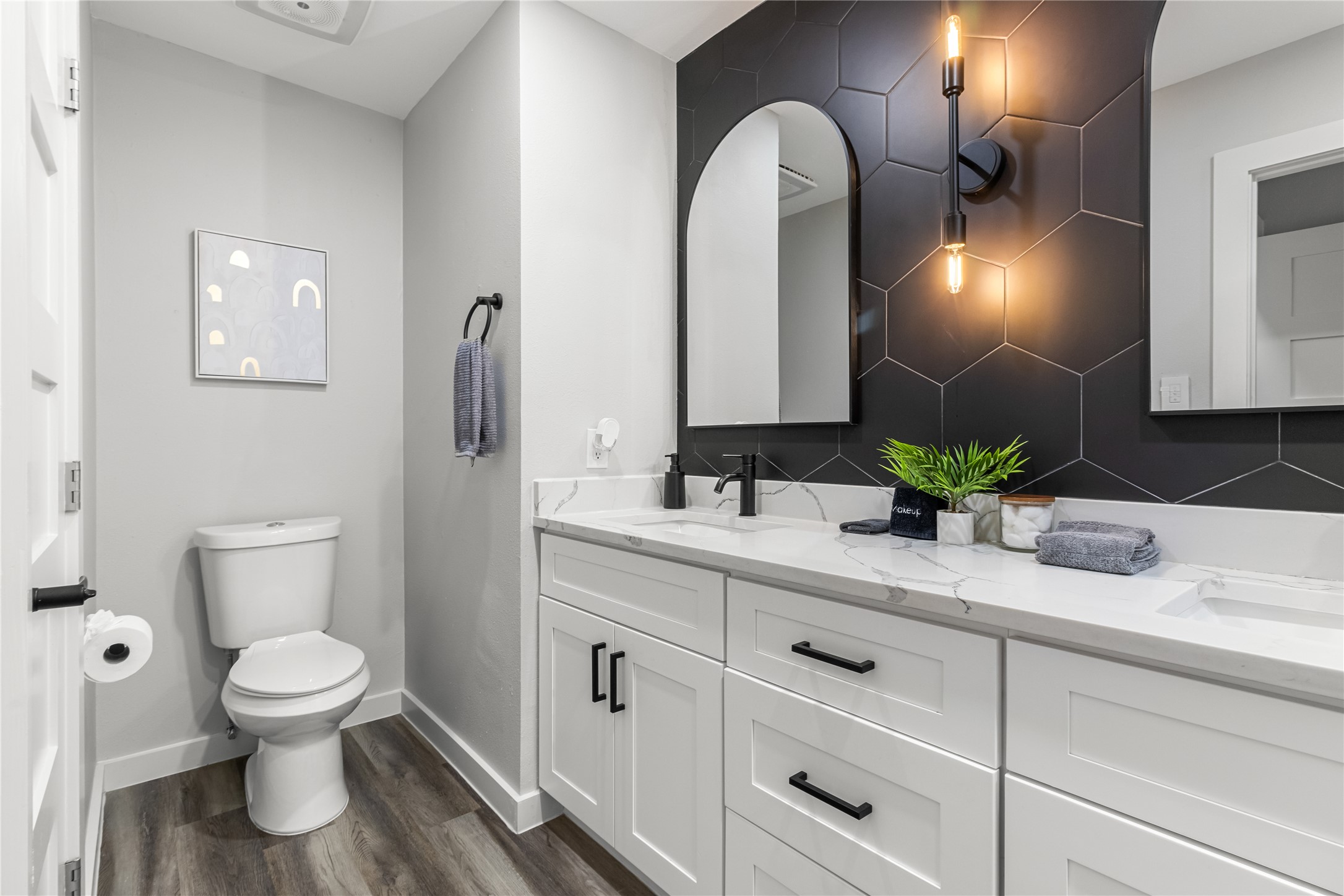 5405 Meadow Crest Austin, TX 78744 - Photo 17 of 33 a bathroom with a toilet sink and mirror