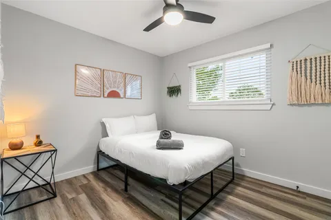 a bedroom with a bed and window