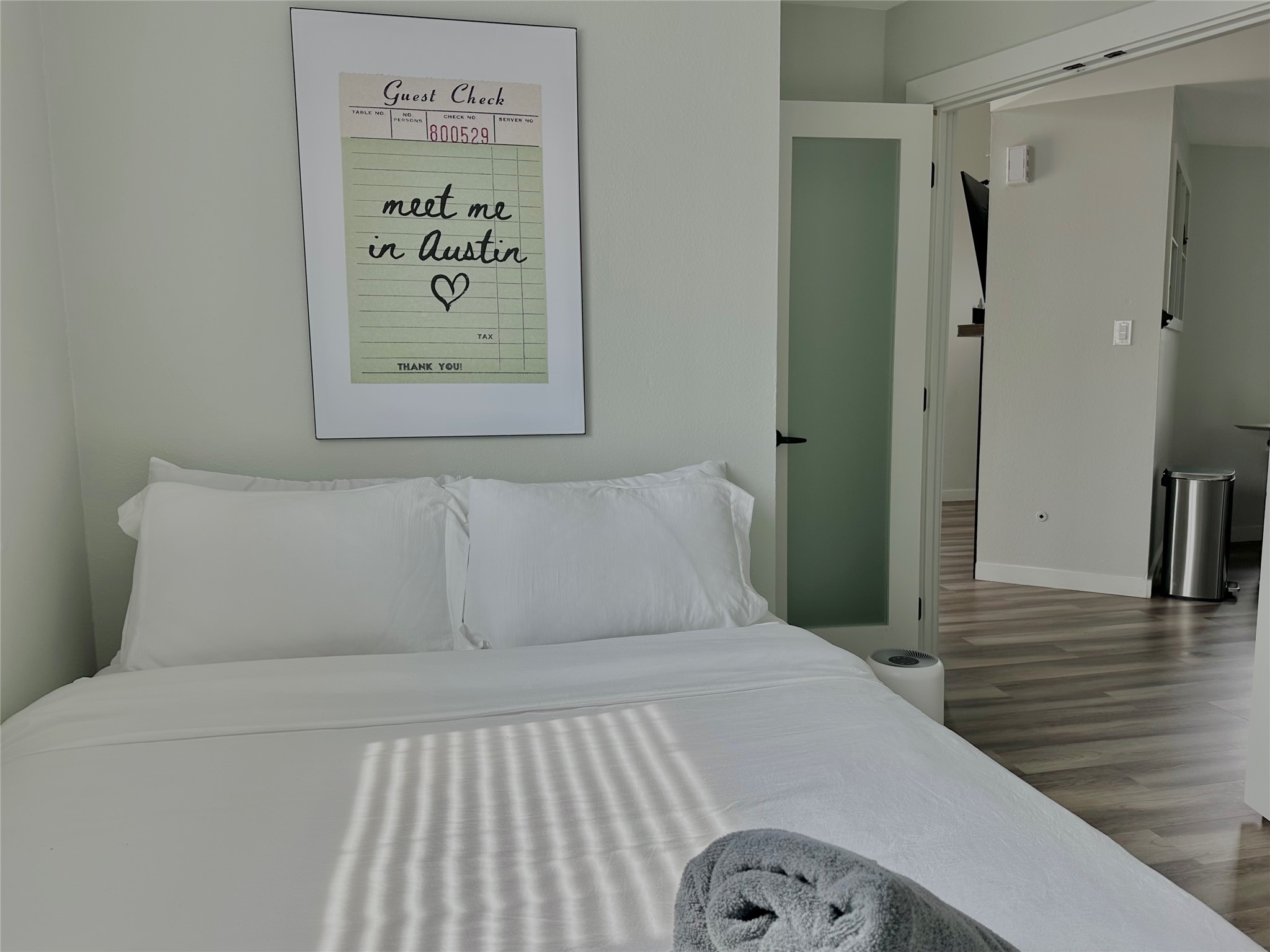 5405 Meadow Crest Austin, TX 78744 - Photo 20 of 33 a bedroom with a bed and a view of a bathroom