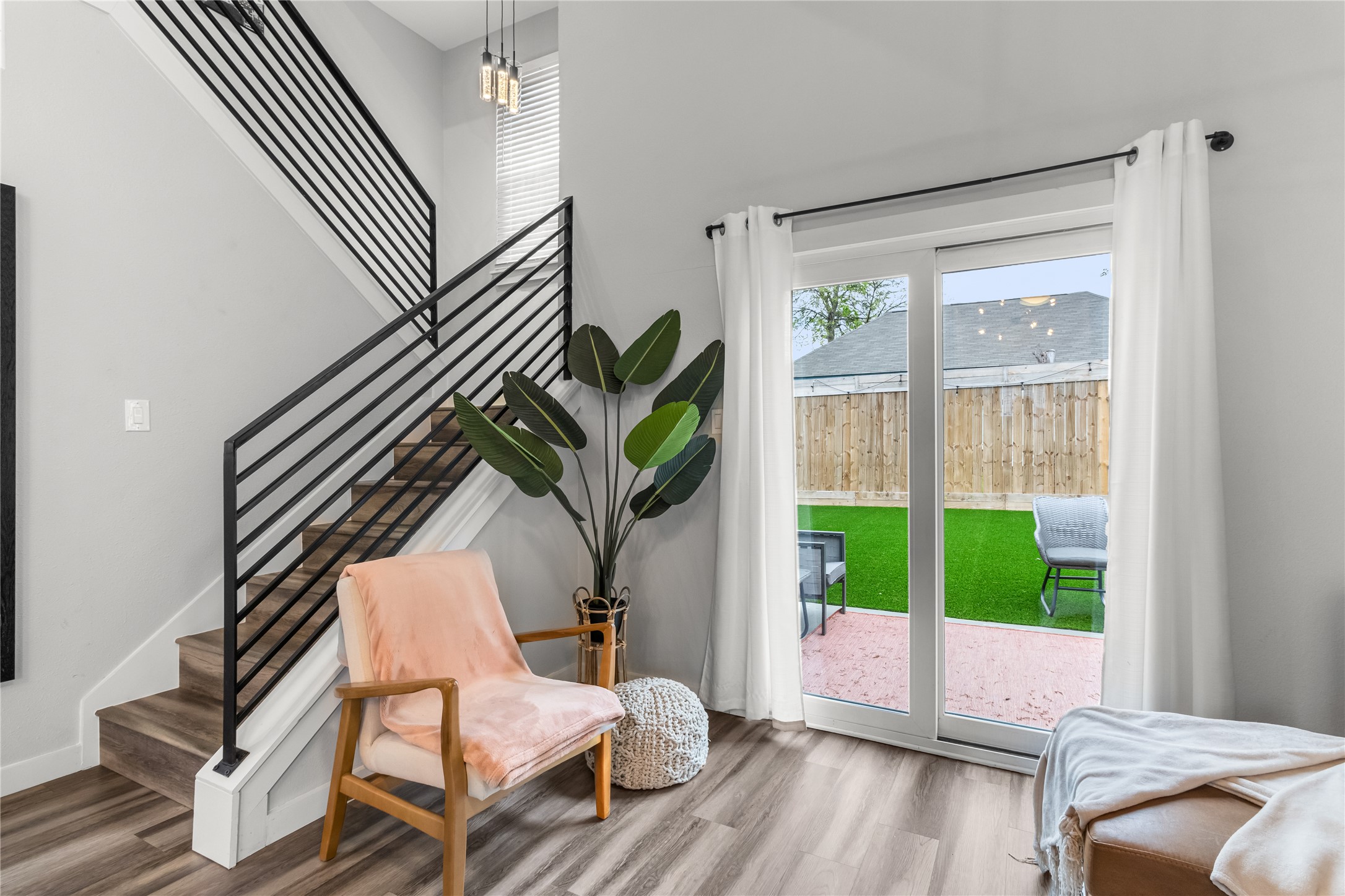 5405 Meadow Crest Austin, TX 78744 - Photo 2 of 33 a living room with a balcony furniture and a large window