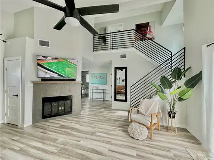 a view of a livingroom with furniture and a fireplace
