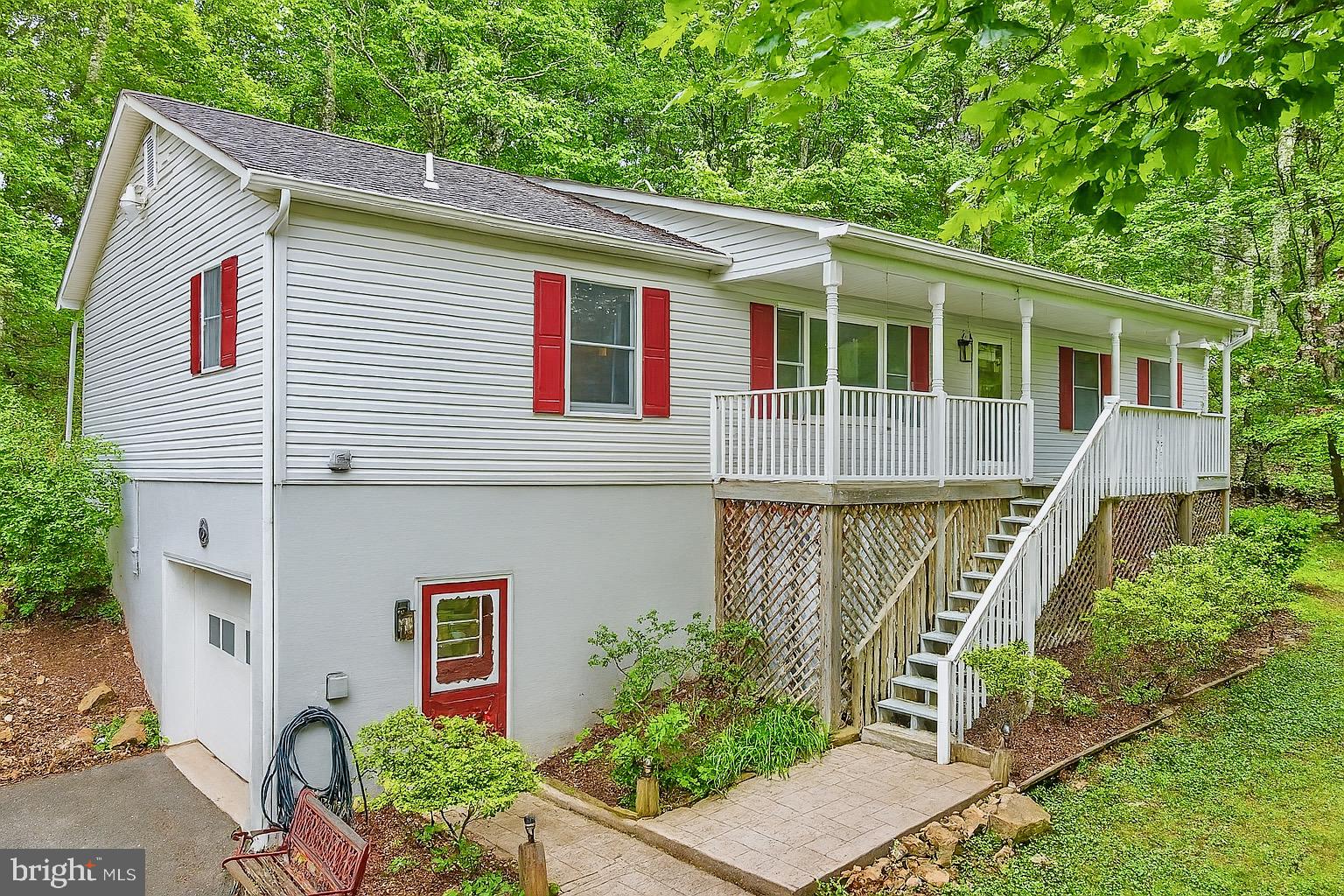 1420 Fishel Road Winchester, VA 22602 - Photo 2 of 34 a front view of a house with plants