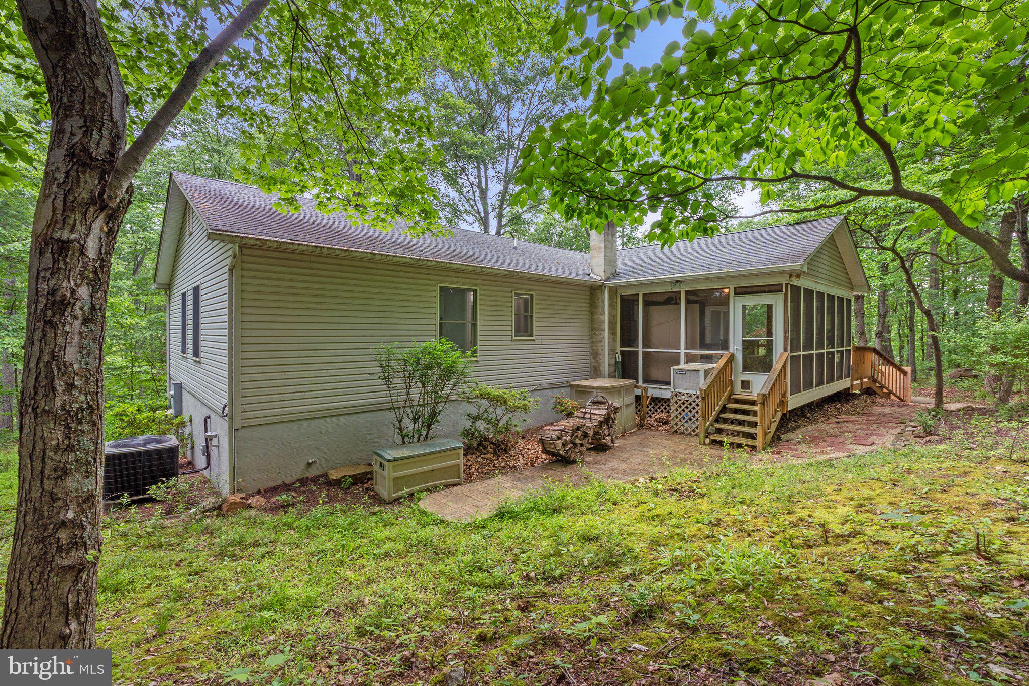 1420 Fishel Road Winchester, VA 22602 - Photo 25 of 34 a view of a chair and table in backyard of the house