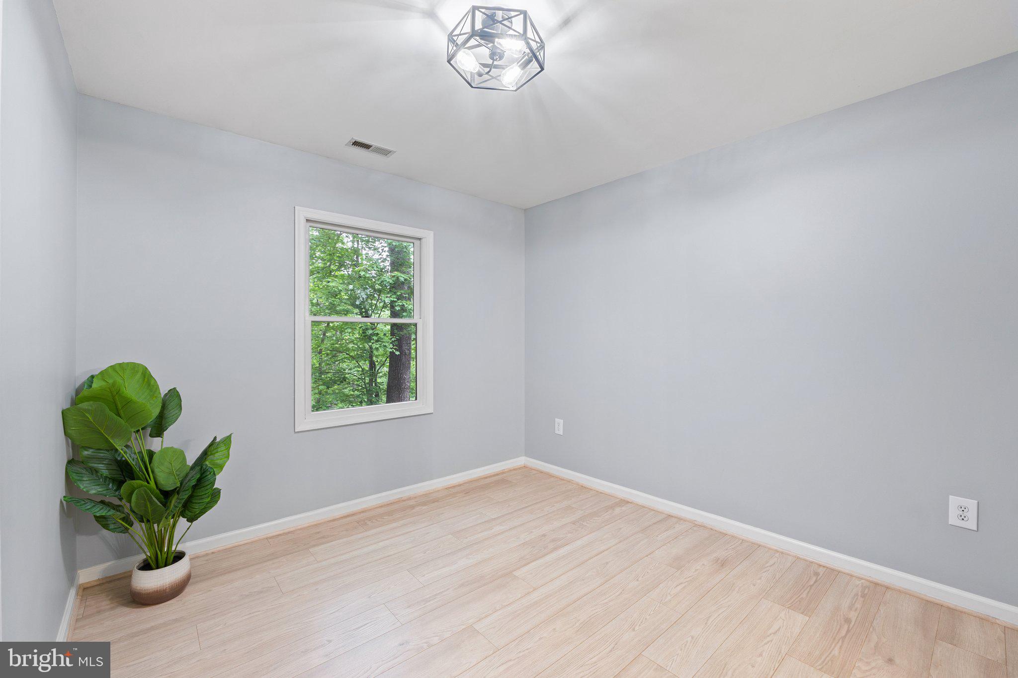 1420 Fishel Road Winchester, VA 22602 - Photo 7 of 34 a view of empty room with window and flower pot