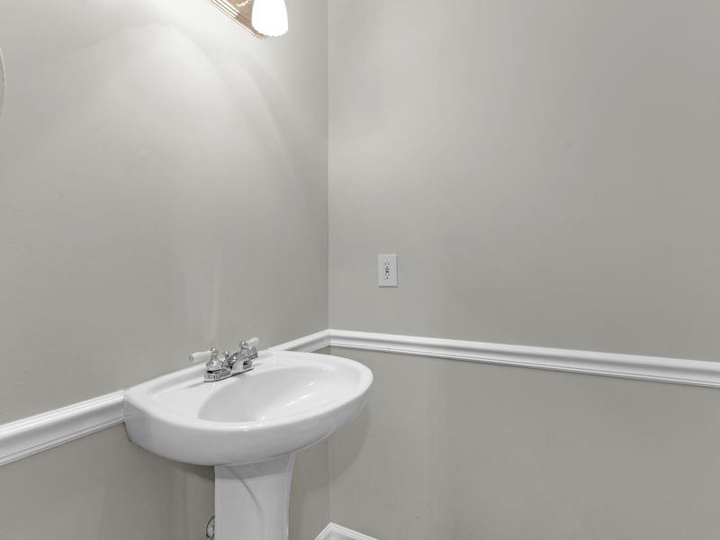 9300 Floyd Road Jonesboro, GA 30236 - Photo 14 of 34 a bathroom with a sink and mirror