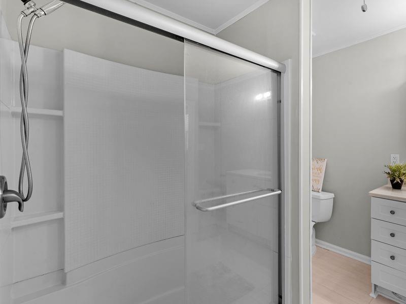 9300 Floyd Road Jonesboro, GA 30236 - Photo 18 of 34 a bathroom with a shower and a toilet