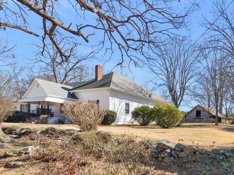 9300 Floyd Road Jonesboro, GA 30236 - Photo 2 of 34 a front view of a house with a yard covered in snow