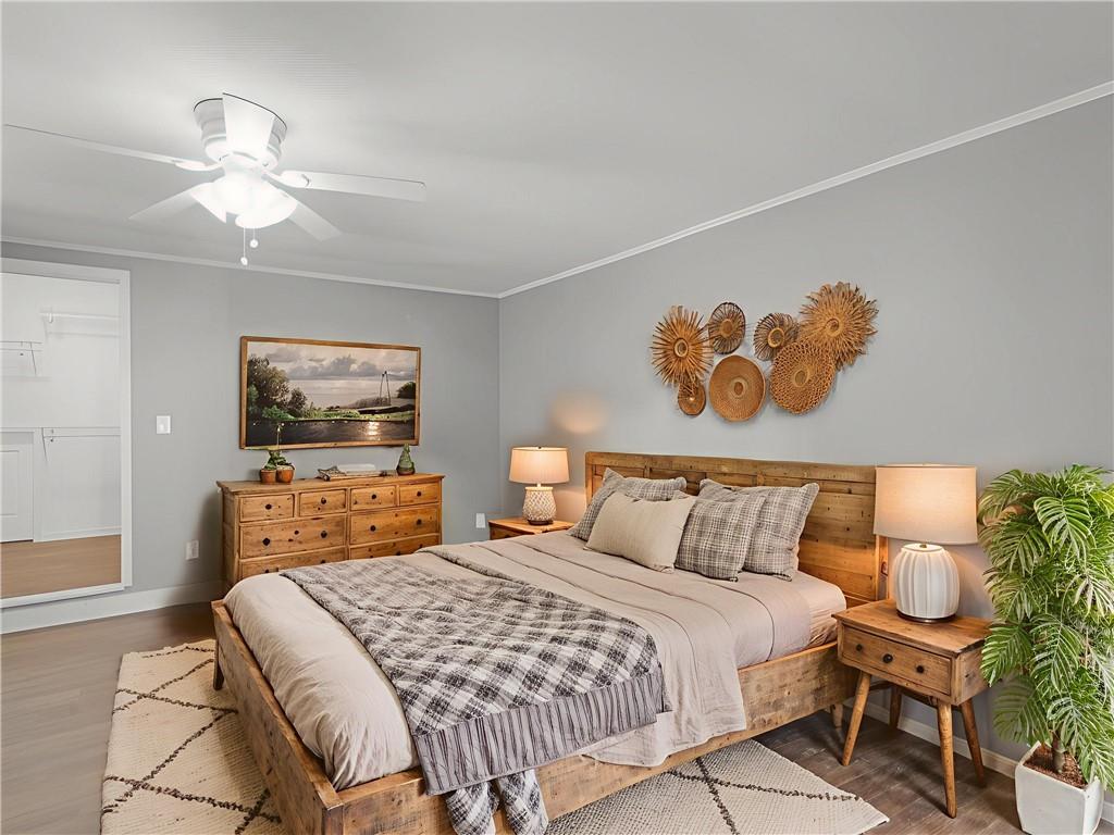 9300 Floyd Road Jonesboro, GA 30236 - Photo 24 of 34 a bedroom with a bed and a flat screen tv