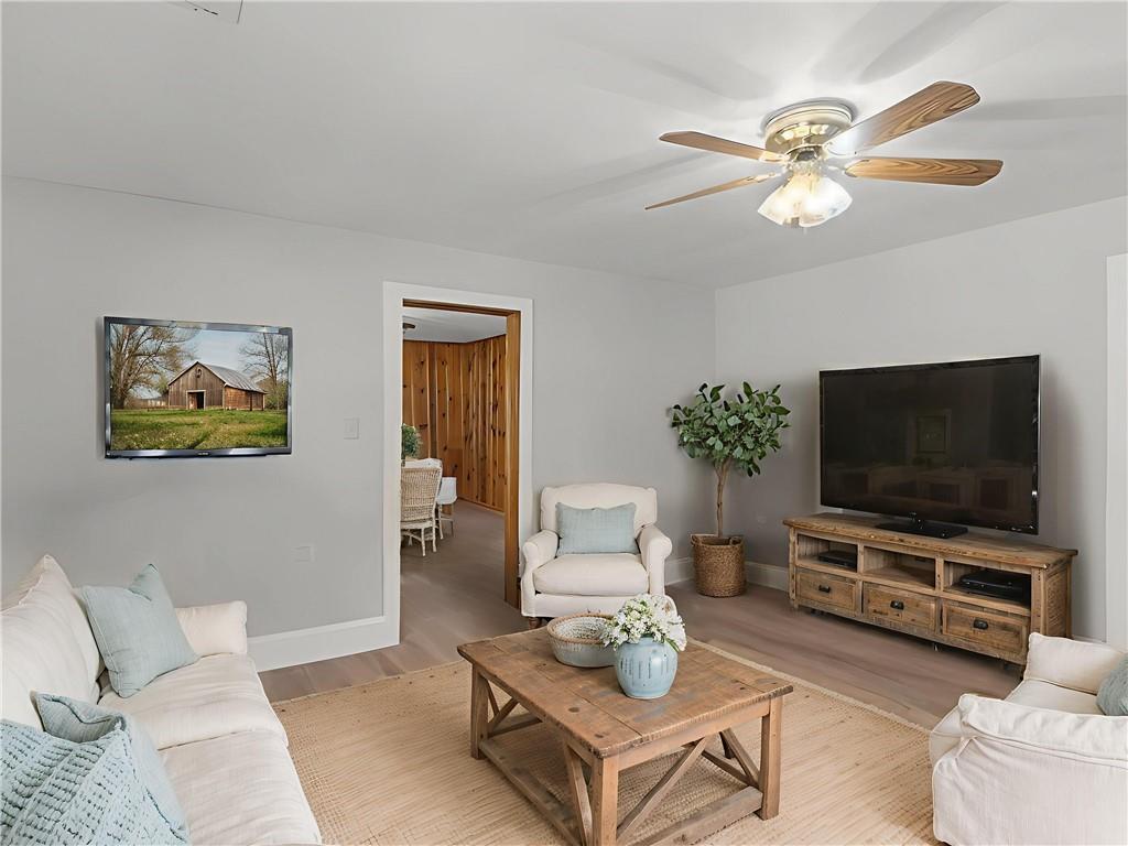 9300 Floyd Road Jonesboro, GA 30236 - Photo 5 of 34 a living room with furniture and a flat screen tv
