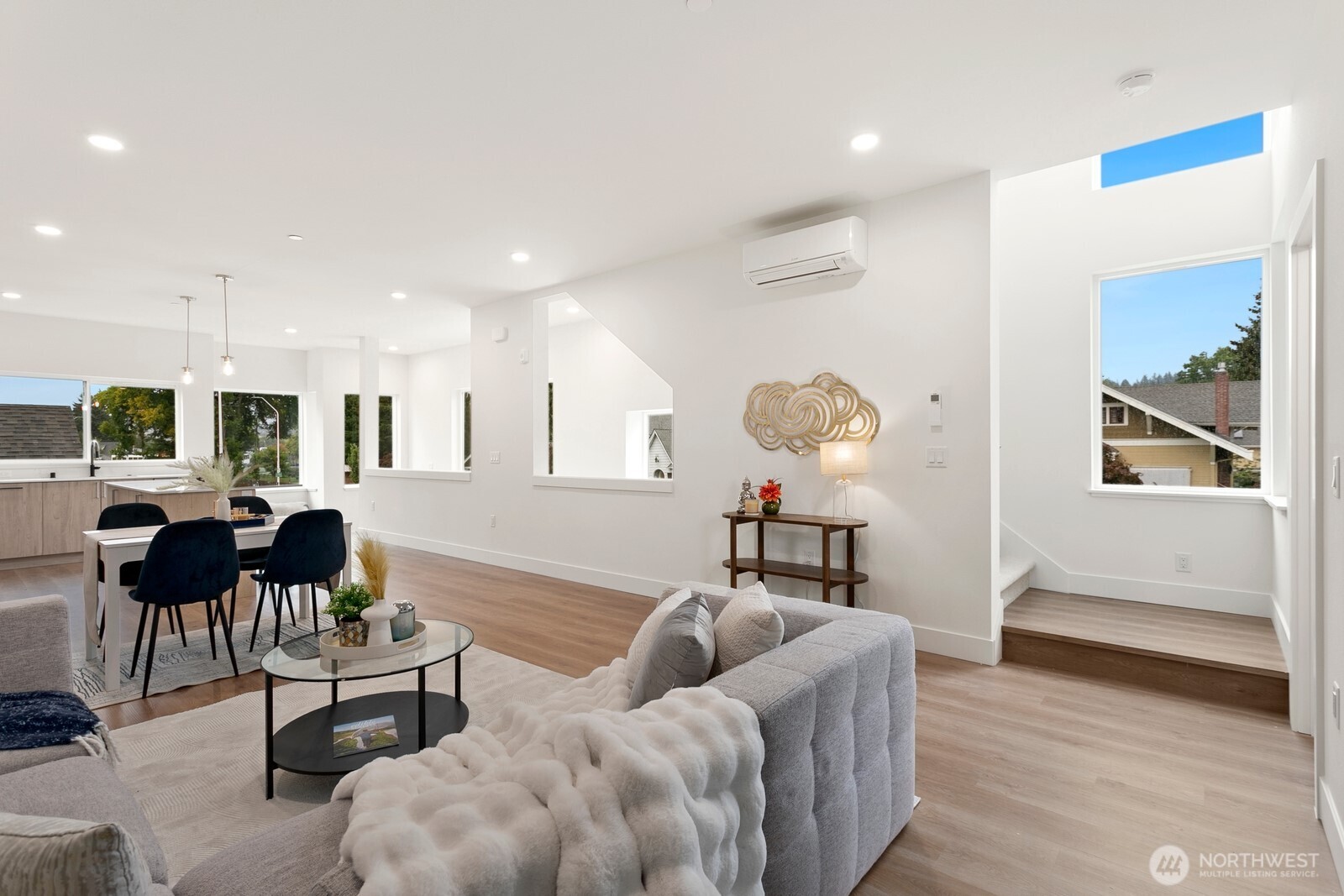 117 Wells Avenue South, Unit A Renton, WA 98057 - Photo 13 of 31 a living room with furniture and wooden floor