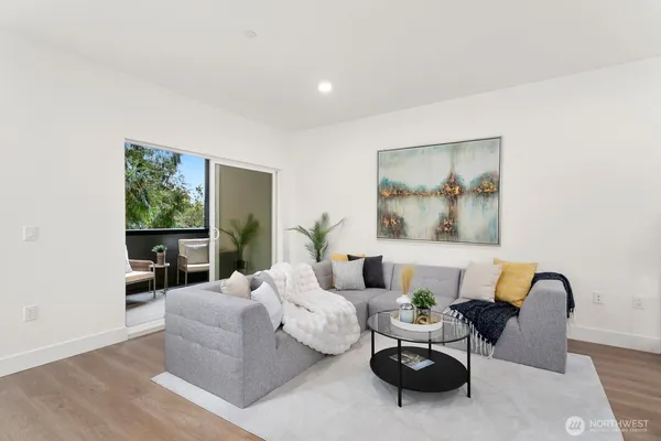 a living room with furniture and a large window