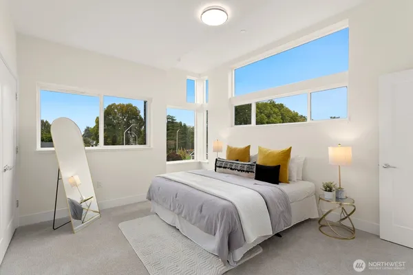 a bed room with a bed and a chair