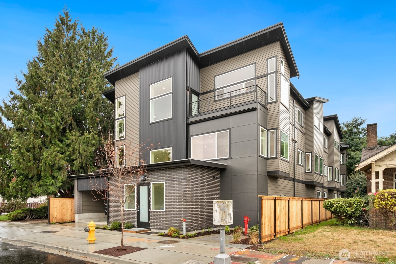 117 Wells Avenue South, Unit A Renton, WA 98057 - Photo 3 of 31 a front view of a building with street view