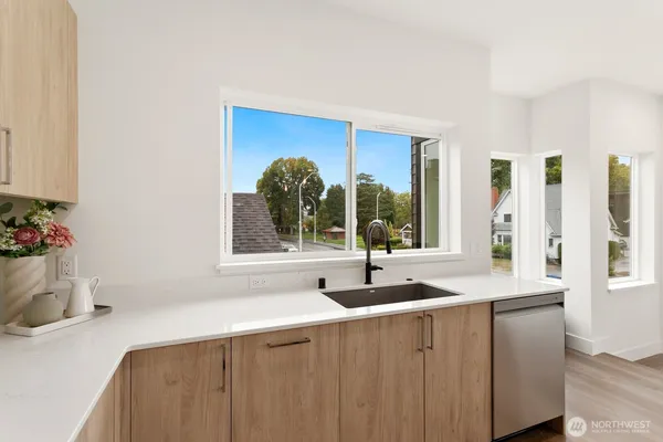 a kitchen with a sink and a window
