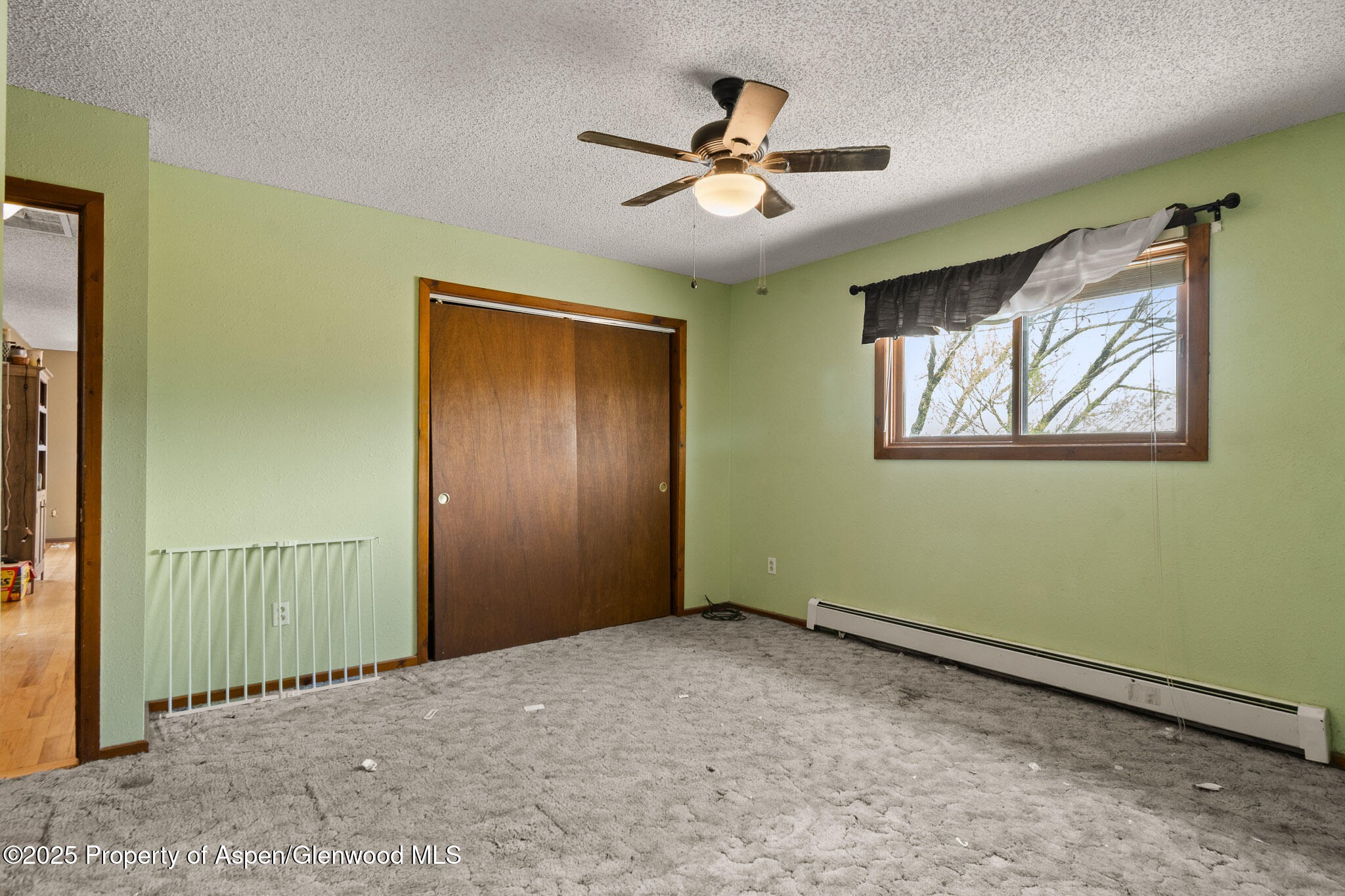 580 Will Avenue Rifle, CO 81650 - Photo 21 of 24 a view of a livingroom with a ceiling fan and window