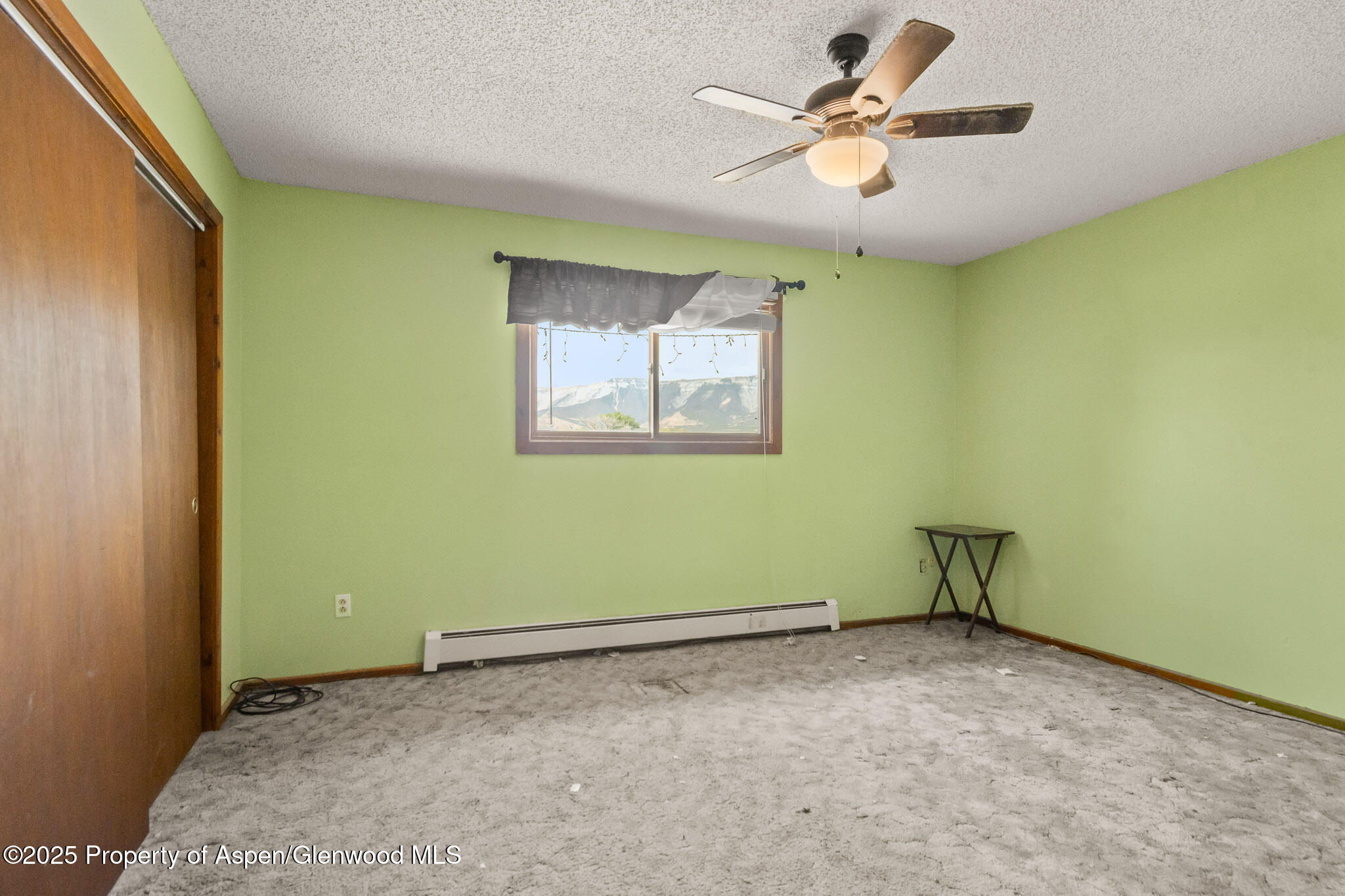 580 Will Avenue Rifle, CO 81650 - Photo 22 of 24 a view of room with window and ceiling fan