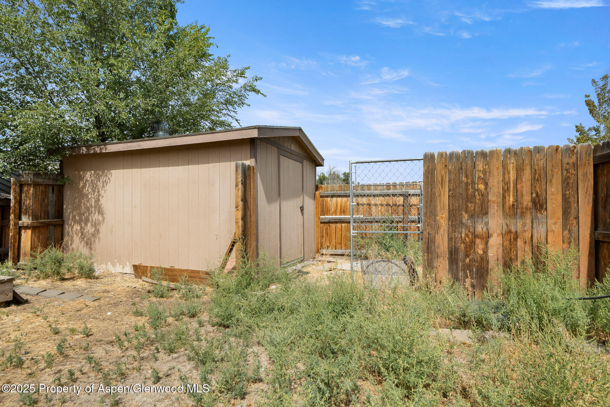 580 Will Avenue Rifle, CO 81650 - Photo 23 of 24 a backyard of a house with table and chairs