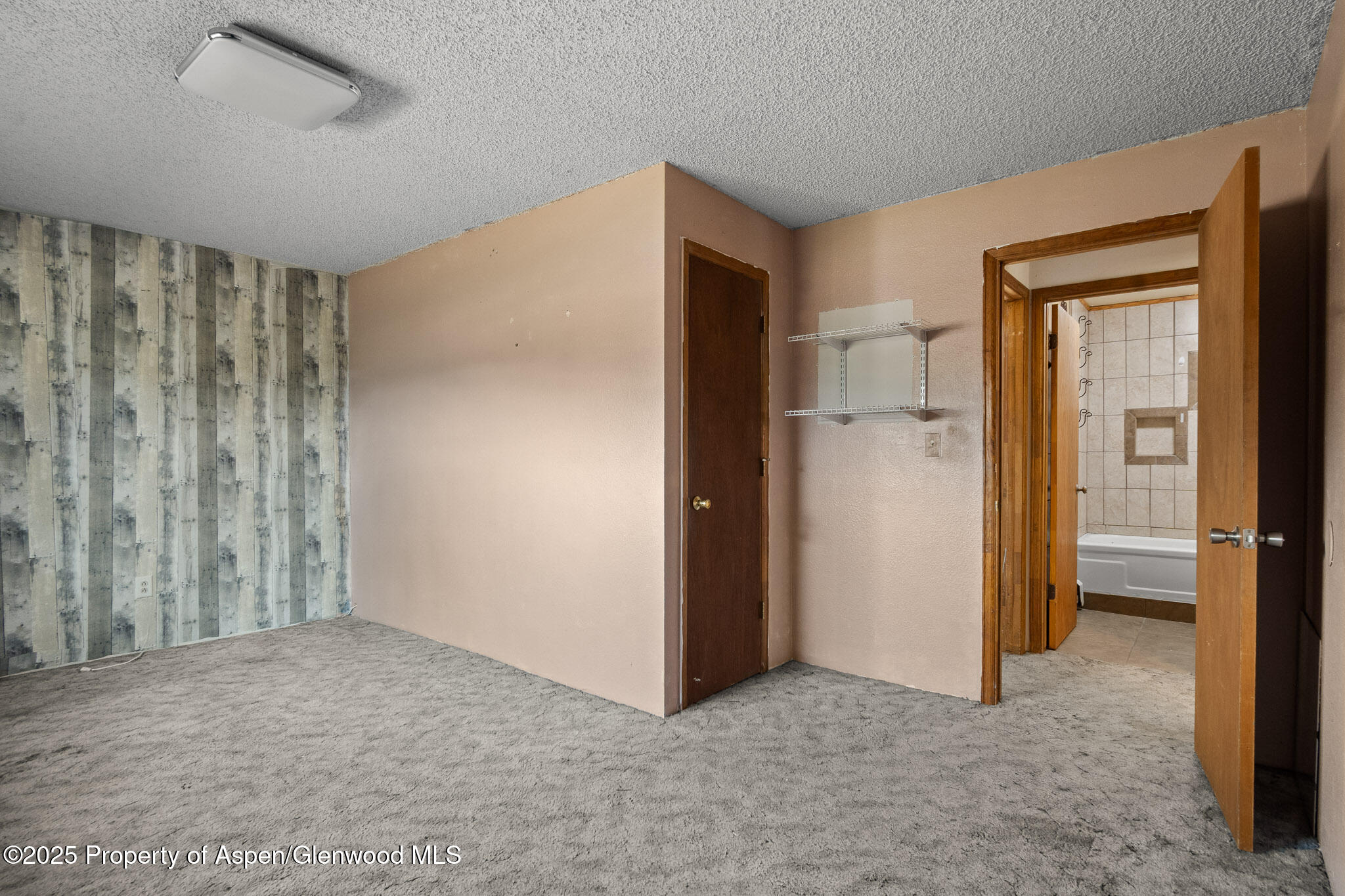 580 Will Avenue Rifle, CO 81650 - Photo 9 of 24 a view of empty room with a ceiling fan