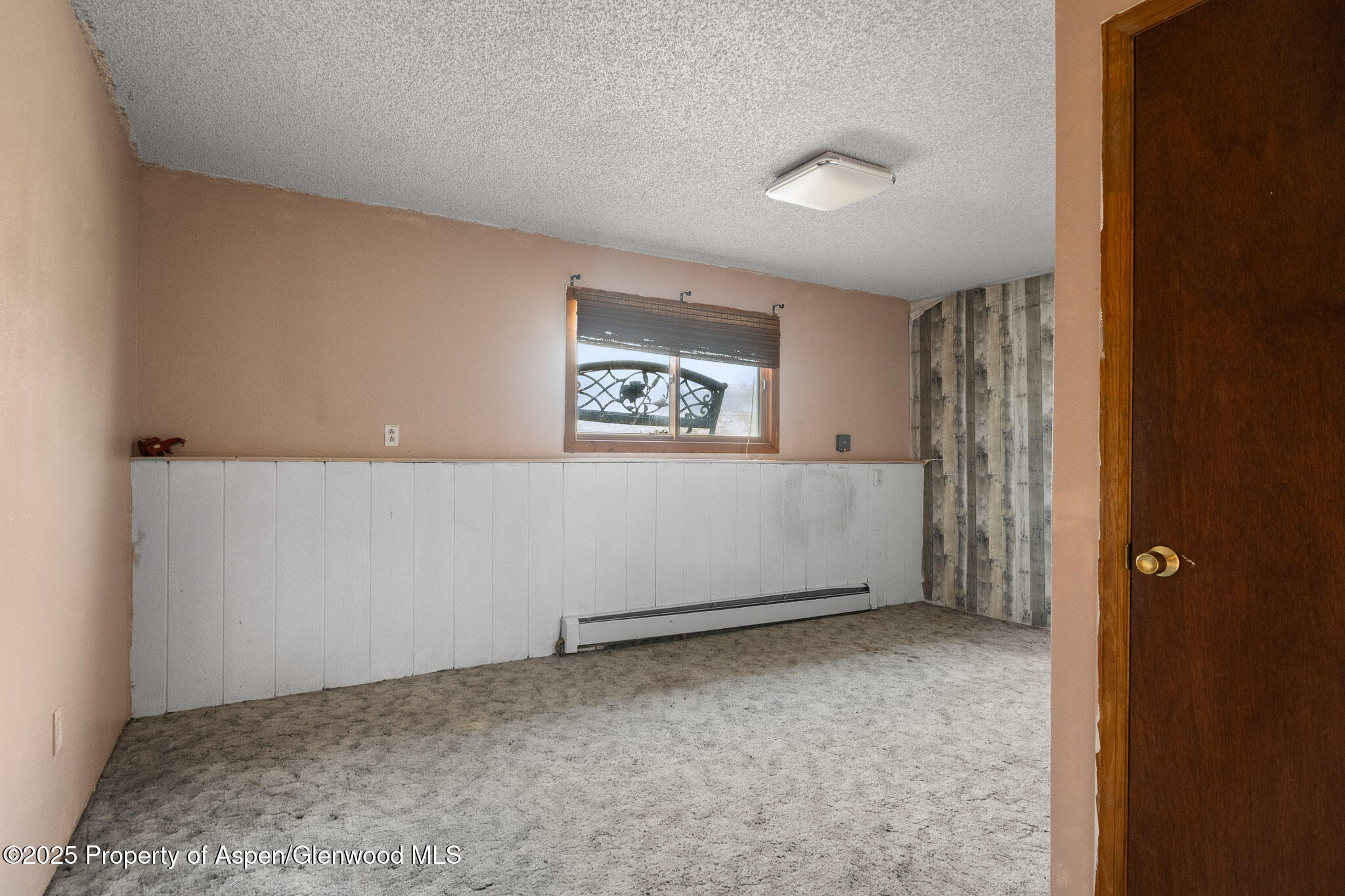 580 Will Avenue Rifle, CO 81650 - Photo 10 of 24 a view of an empty room with a window