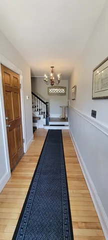 a view of a hallway with a chandelier