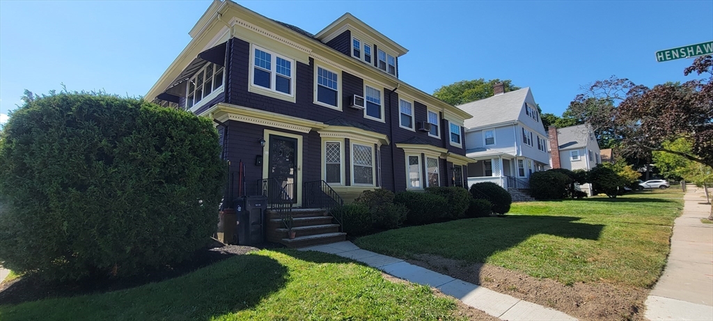 88 Corey Street, Unit 2 Boston, MA 02132 - Photo 23 of 23 a front view of a house with a yard