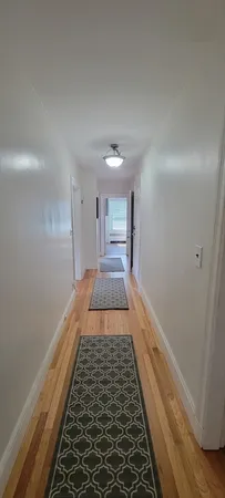 a kitchen with a refrigerator sink and cabinets