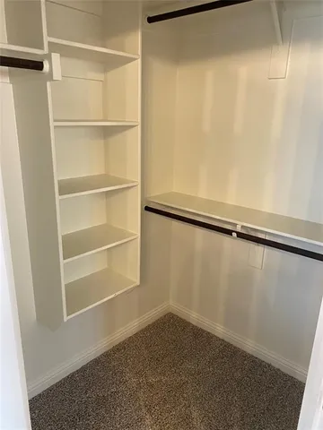 a view of a room with racks on the wall