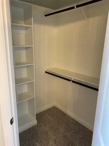 a view of an empty walk in closet