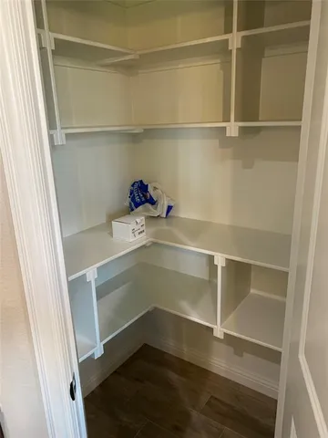 a storage room with wooden floor